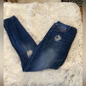 Refuge medium wash denim distressed 5 pocket jeans Woman’s size 12